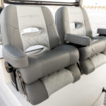 Premium helm seats with retractable armrests - leaning bolsters up