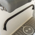 Retractable helm footrest