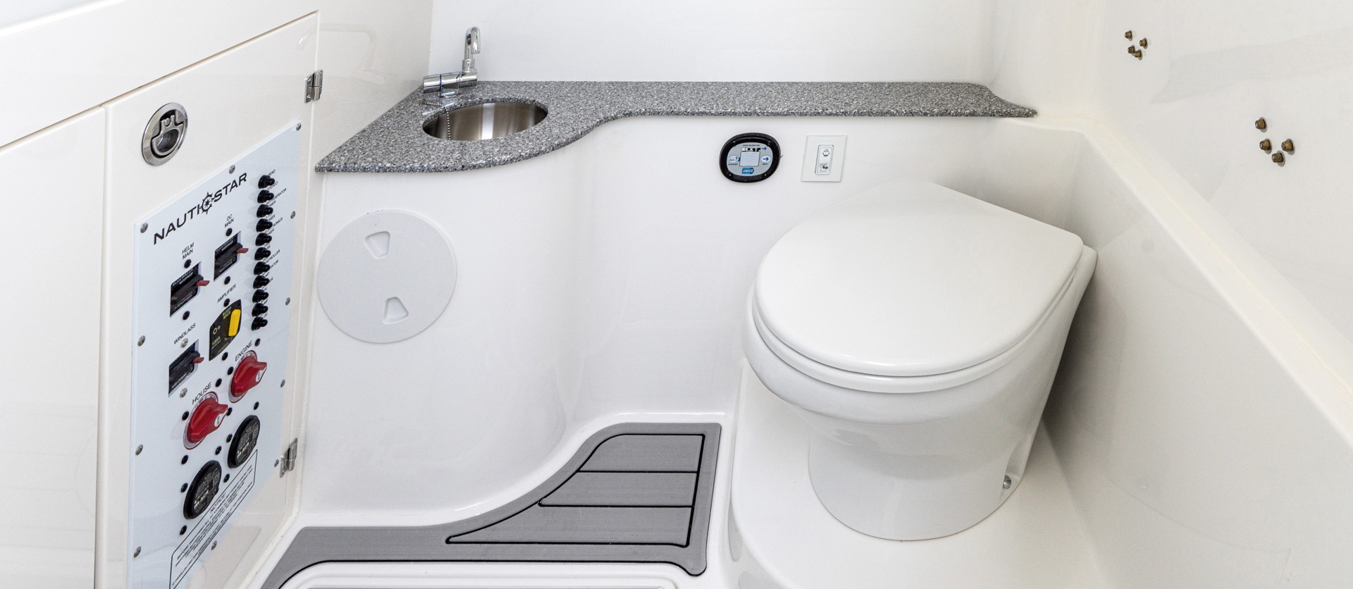 Guests will appreciate the privacy and comfort of an enclosed head with electric flush and sink.