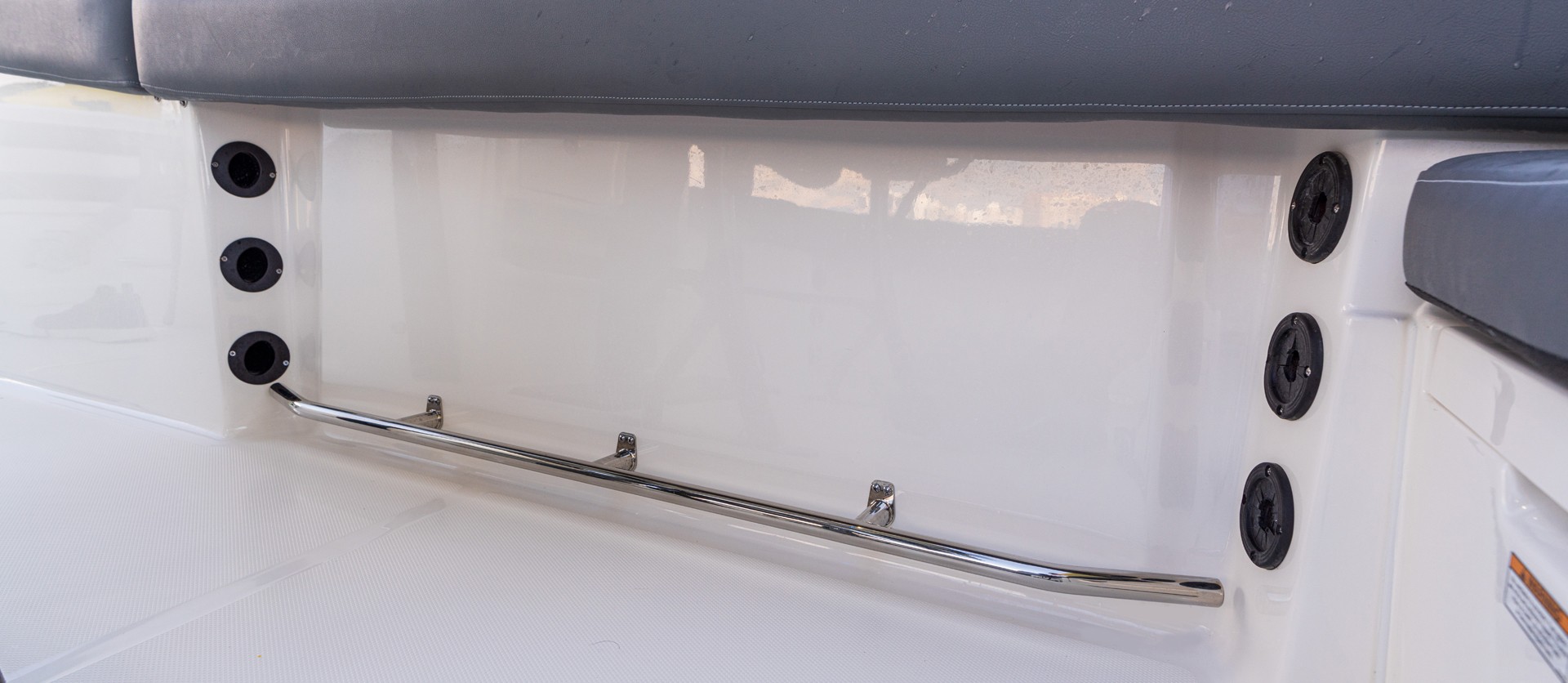 Sturdy rod racks are mounted under the gunwale keeping poles close-at-hand and out of harm’s way. Toe rails provide additional grip in rough seas.