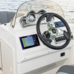 Ergonomically-designed fiberglass console with gauges, stereo, Simrad NSX7 (7” screen), and more