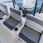 3 across rear folding jump seats with under seat cast net, livewell and battery storage