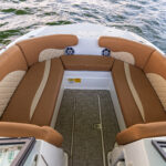 Bow chaise seating with bolsters and under deck storage
