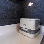 Head with portable toilet