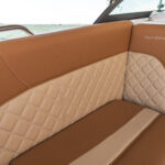 Bow chaise seating with bolsters and under deck storage