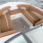 Bow chaise seating with bolsters and under deck storage