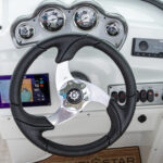 Ergonomically-designed fiberglass console with gauges, stereo, Simrad NSX7 (7” screen), and more